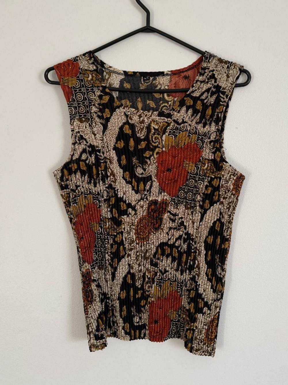 Brown patterned smocked sleeveless shirt